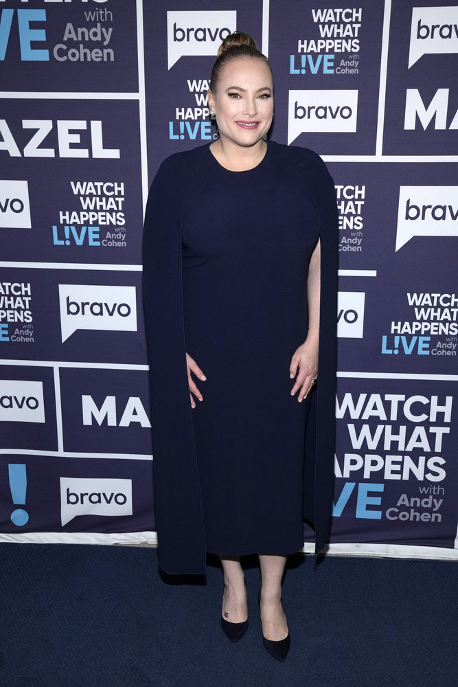 Meghan McCain wears a dark blue cape backstage at Watch What Happens Live